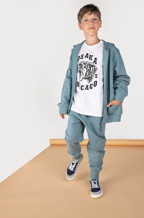 Дитячі спортивні штани Coccodrillo колір бірюзовий однотонні Дитячі спортивні штани Coccodrillo колір бірюзовий однотонні