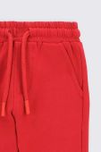 Дитячі спортивні штани Coccodrillo колір червоний однотонні