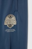 Дитячі спортивні штани adidas Originals з принтом колір блакитний