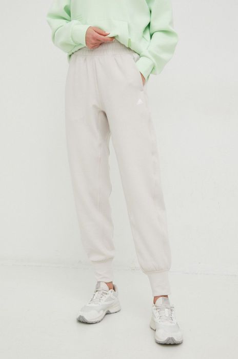 Спортивні штани adidas Performance Studio жіночі колір бежевий однотонні Спортивні штани adidas Performance Studio жіночі колір бежевий однотонні