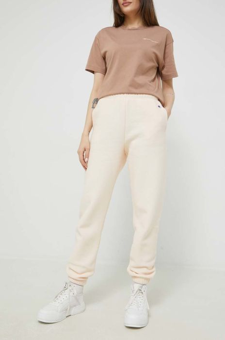 Спортивні штани Champion жіночі колір бежевий з аплікацією Спортивні штани Champion жіночі колір бежевий з аплікацією