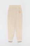 Дитячі спортивні штани Guess колір бежевий однотонні (2583398) Дитячі спортивні штани Guess колір бежевий однотонні (2583398)