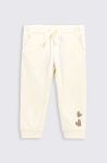 Дитячі спортивні штани Coccodrillo колір бежевий з принтом Дитячі спортивні штани Coccodrillo колір бежевий з принтом
