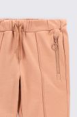 Дитячі бавовняні штани Coccodrillo колір рожевий однотонні (2704358)