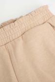 Дитячі спортивні штани Coccodrillo колір бежевий однотонні (3584906) Дитячі спортивні штани Coccodrillo колір бежевий однотонні (3584906)