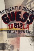 Дитячий бавовняний лонгслів Guess колір бежевий візерунок Дитячий бавовняний лонгслів Guess колір бежевий візерунок