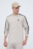 Бавовняний лонгслів adidas Originals колір бежевий з аплікацією Бавовняний лонгслів adidas Originals колір бежевий з аплікацією