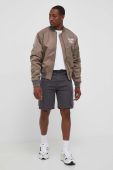 Куртка-бомбер Karl Kani чоловічий колір коричневий перехідна