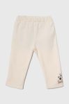 Дитячі спортивні штани United Colors of Benetton колір бежевий з принтом Дитячі спортивні штани United Colors of Benetton колір бежевий з принтом