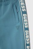 Дитячі спортивні штани Guess з принтом колір блакитний Дитячі спортивні штани Guess з принтом колір блакитний
