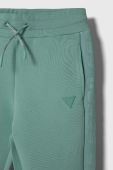 Дитячі спортивні штани Guess колір бірюзовий однотонні Дитячі спортивні штани Guess колір бірюзовий однотонні