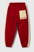 Дитячі бавовняні штани United Colors of Benetton колір червоний візерунок