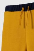 Дитячі спортивні штани United Colors of Benetton колір жовтий візерунок