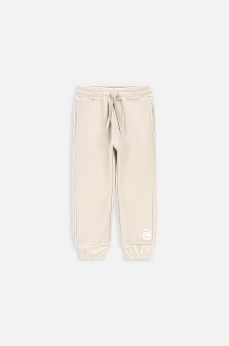 Дитячі спортивні штани Coccodrillo колір бежевий однотонні (3642301)