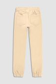 Дитячі бавовняні штани Coccodrillo колір бежевий однотонні (3191445)