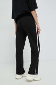 Спортивні штани Tommy Jeans жіночі колір чорний з принтом