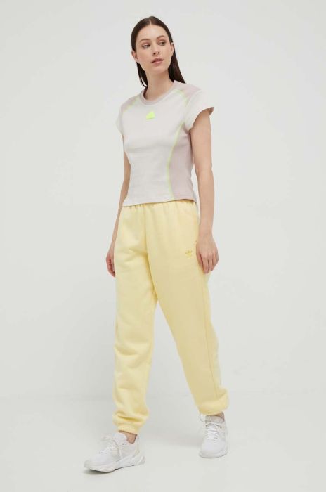 Спортивні штани adidas Originals колір жовтий однотонні Спортивні штани adidas Originals колір жовтий однотонні