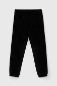 Дитячі бавовняні штани Guess колір чорний з принтом (2902497)