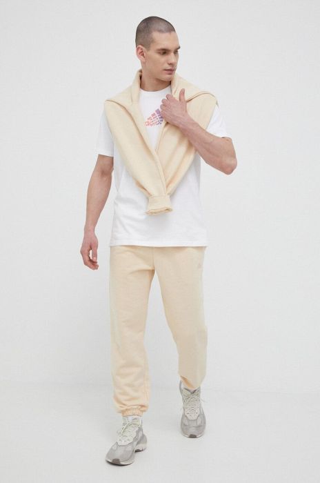 Спортивні штани adidas колір жовтий однотонні Спортивні штани adidas колір жовтий однотонні