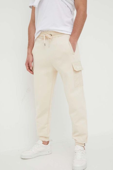 Спортивні штани Alpha Industries колір бежевий однотонні Спортивні штани Alpha Industries колір бежевий однотонні