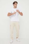Спортивні штани Alpha Industries колір бежевий однотонні Спортивні штани Alpha Industries колір бежевий однотонні